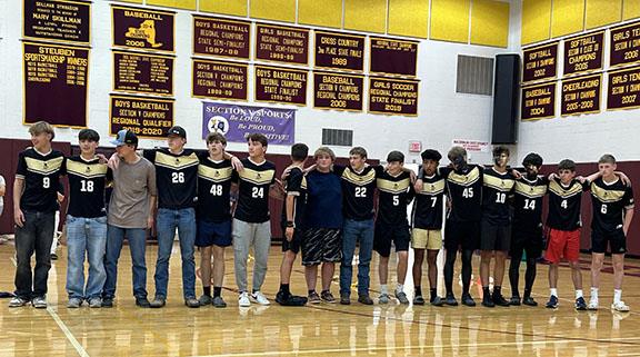 Students in uniform in the high school gym.