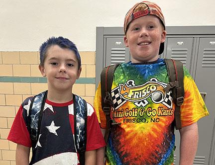 Two students dressed in spirit gear at school.