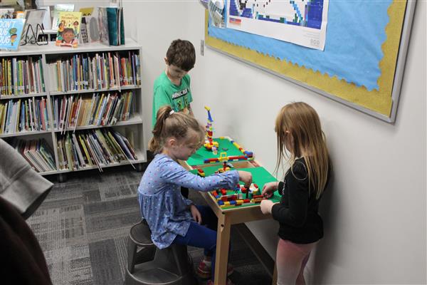 students build with legos